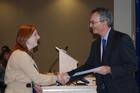 Dean James Goldgeier (r) congratulates Miranda Schaeffer on receiving the Annette Langdon Award. Photo by Annie Lyon.
